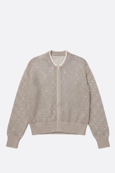 
Détail latéral du gilet beige sable zippé, en coton et tencel ajouré, orné de sequins, idéal pour une tenue chic au...



