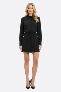 Falda negra con bolsillos oversize botones joya