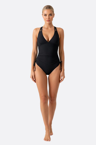 
Maillot de bain noir élégant une pièce avec liens ajustables, idéal pour des journées à la plage ou à la piscine.



