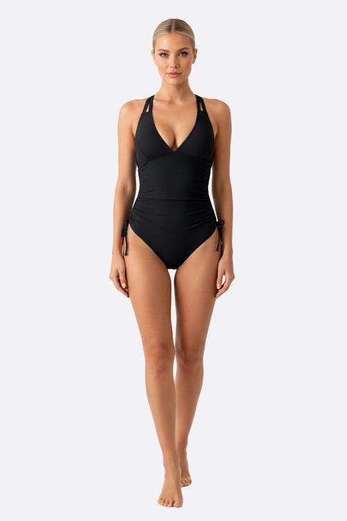
Maillot de bain noir élégant une pièce avec liens ajustables, idéal pour des journées à la plage ou à la piscine.



