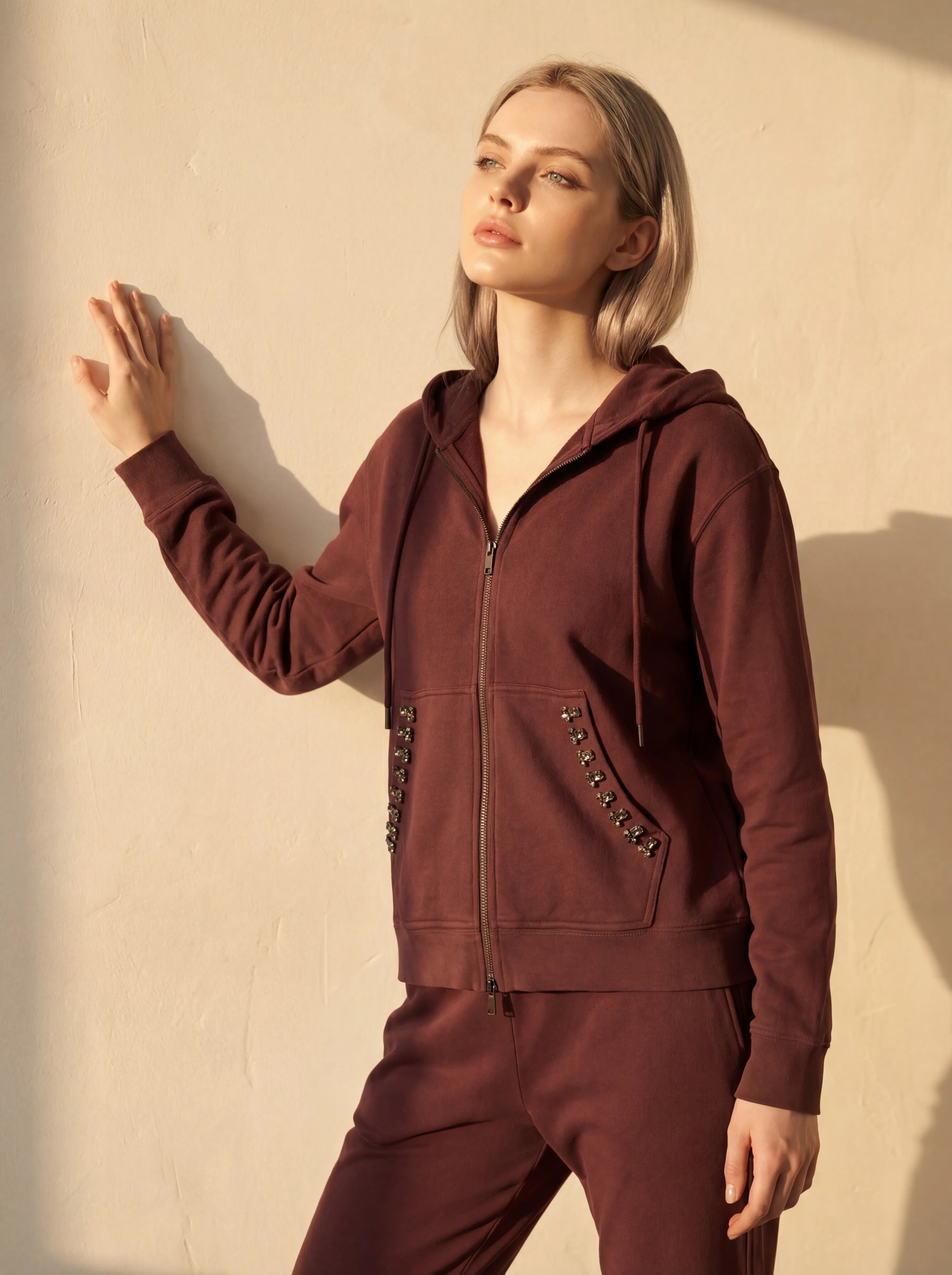 Luxurious brown tracksuit set enhanced with faceted crystals, perfect for a stylish yet comfortable casual look.