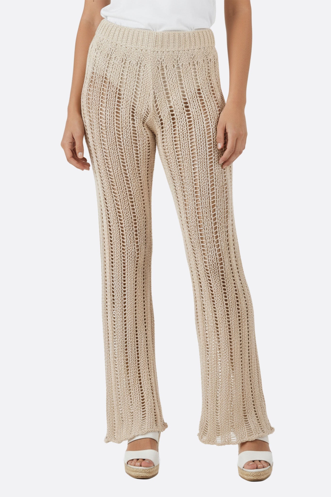 Chic beige crochet knit pants showcasing bohemian elegance for casual outings or summer evenings.