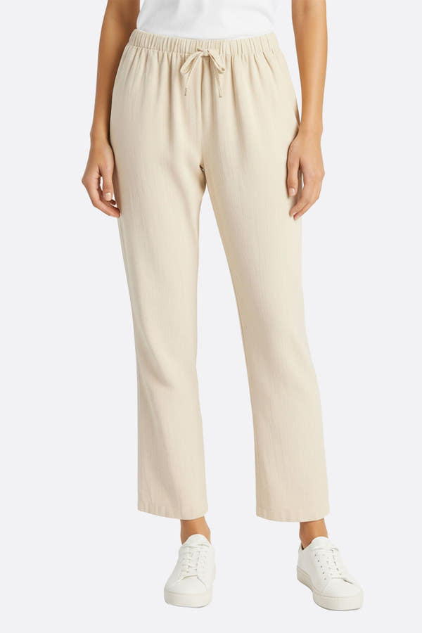 Pantalon léger en lin beige à taille élastique, parfait pour un look décontracté et élégant au quotidien ou en soirée.