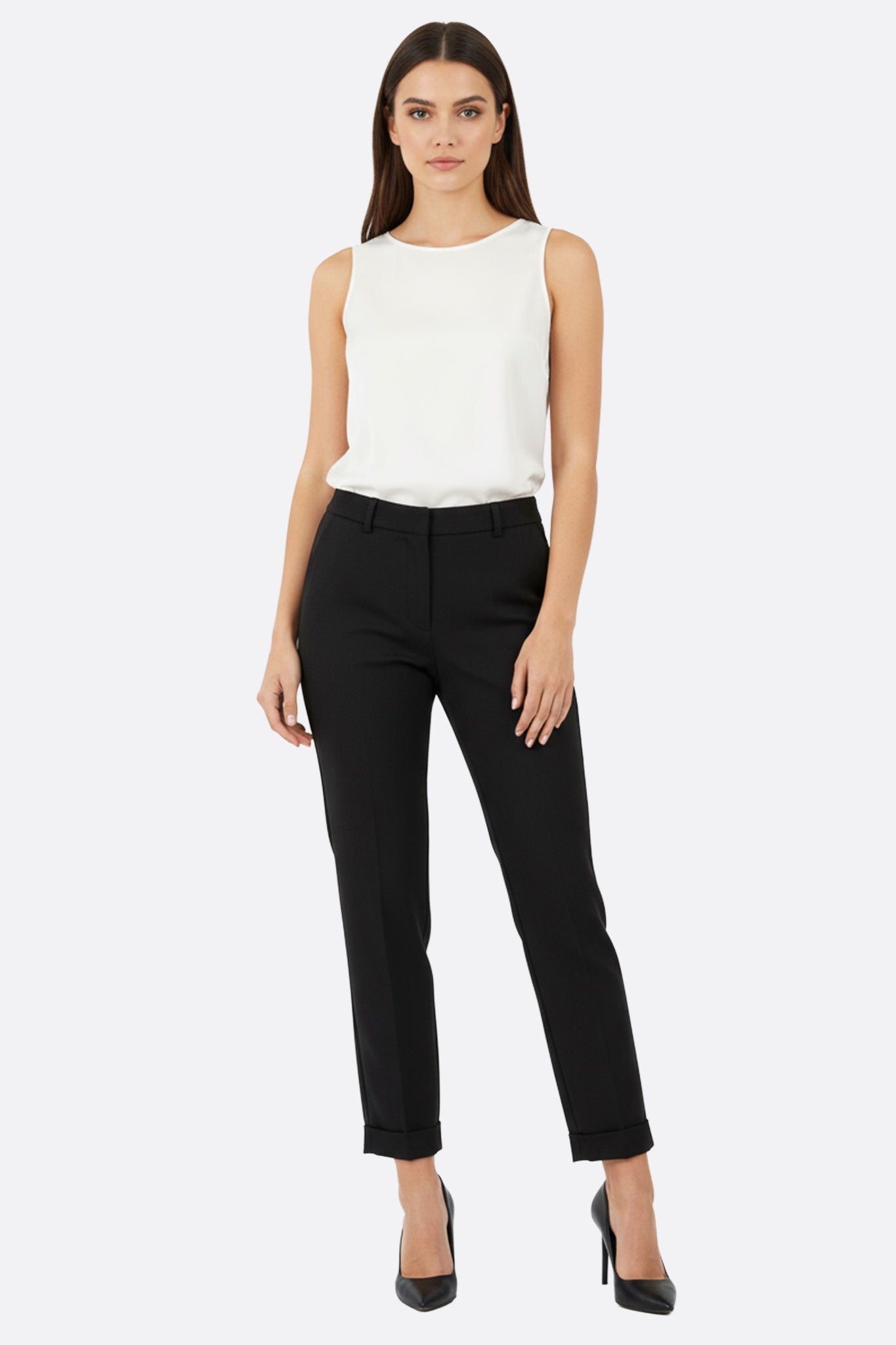 Side view of chic black tailored pants with a structured flow, showcasing refined details, ideal for stylish office attire.
