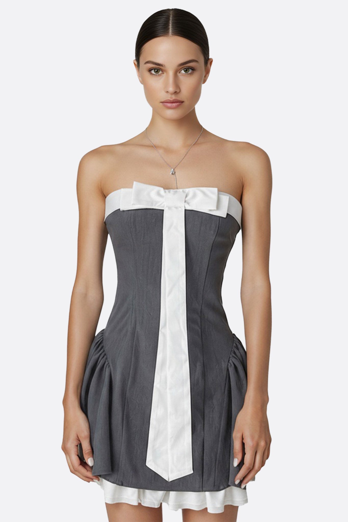 Robe grise bustier chic avec nœud blanc, parfaite pour soirées élégantes et événements raffinés.