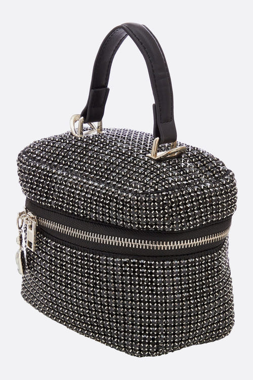 
Zoom sur le sac à main de soirée orné de cristaux noirs, chic et raffiné, idéal pour illuminer vos tenues de gala.



