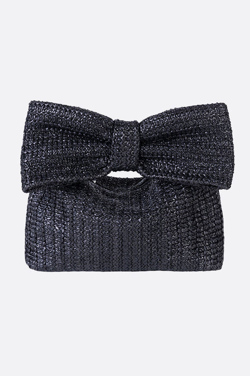 
Sac en raphia noir avec un élégant nœud papillon, accessoire parfait pour sublimer une tenue de soirée raffinée.



