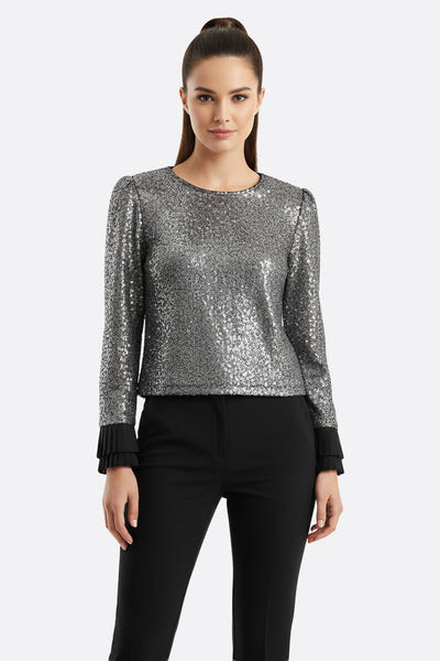 
Top noir scintillant agrémenté de sequins argent, affichant des poignets plissés pour une allure chic lors d'une soirée.



