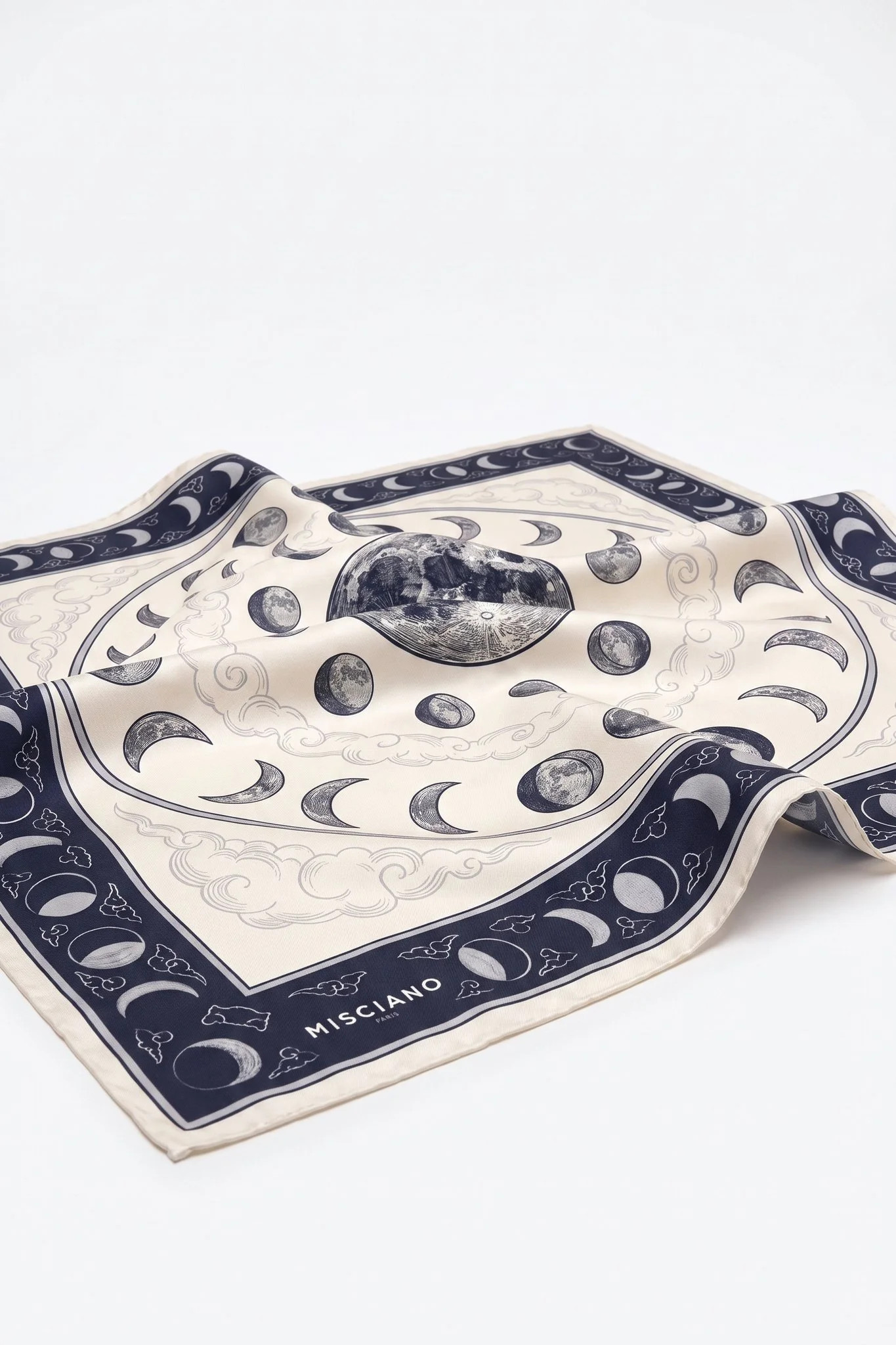 Close-up on the folds of the silk scarf Phases de la lune, silk twill and hand-rolled hem