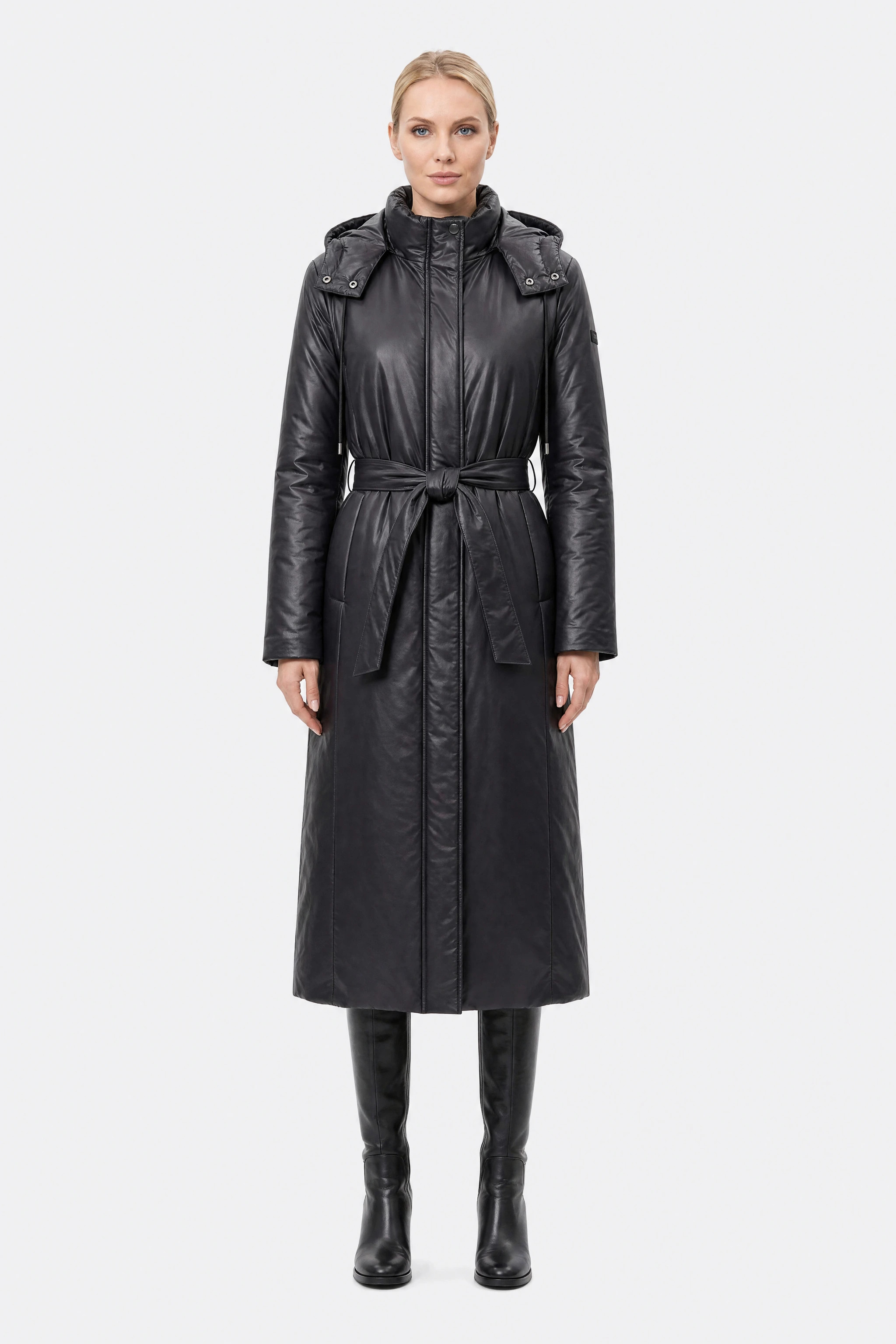 Black belted long puffer jacket, worn, front view