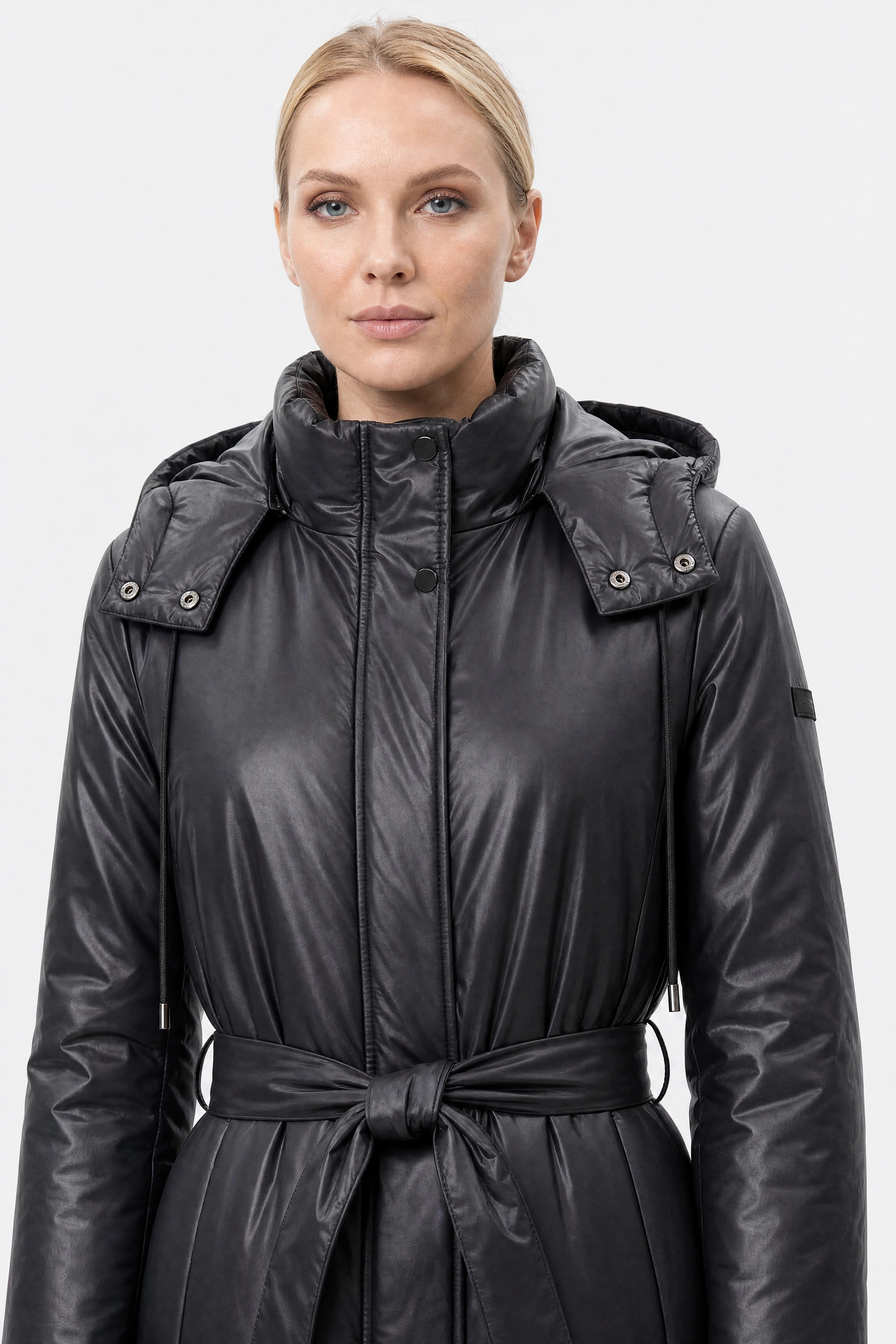 Black belted long puffer jacket, upper detail