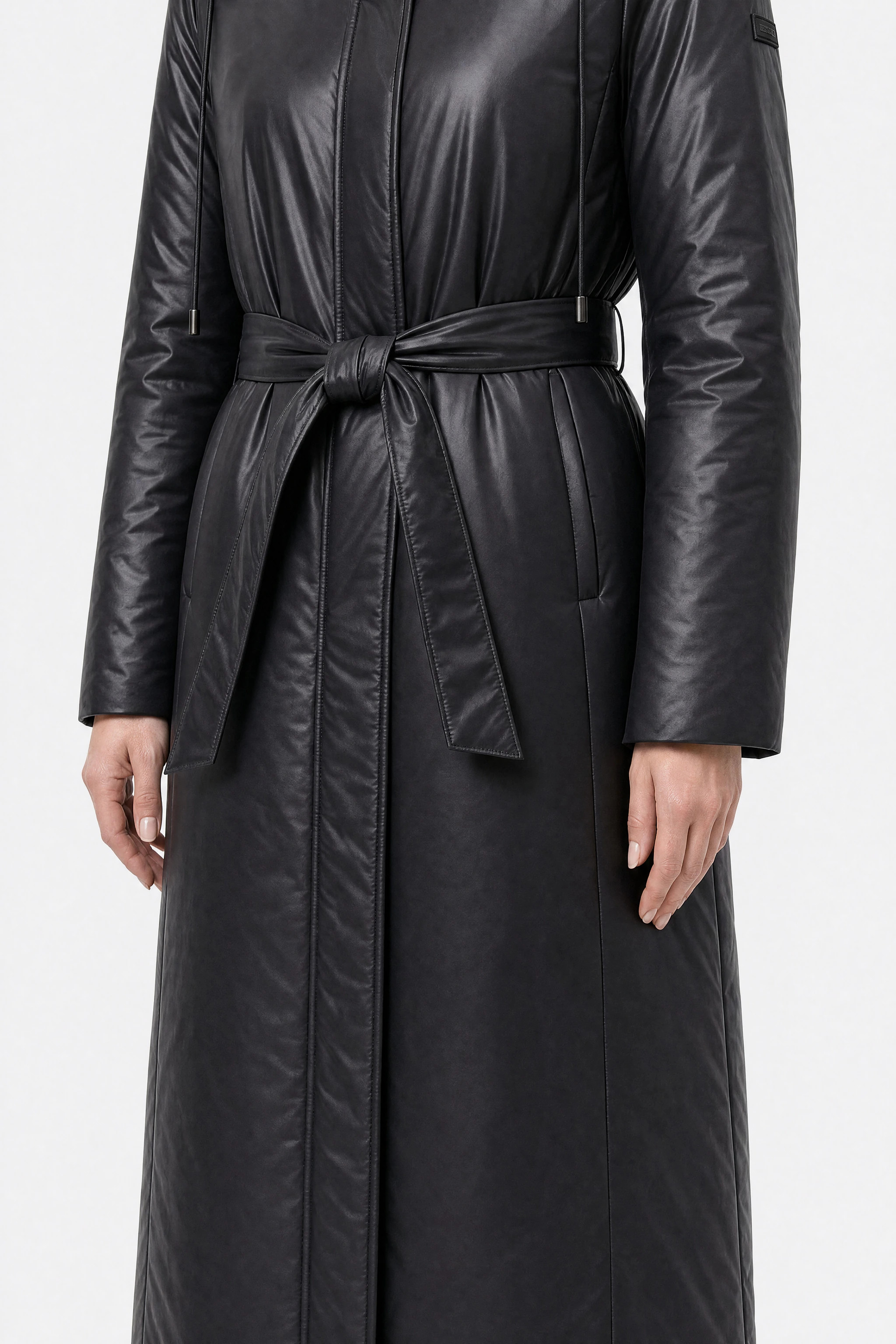 Black belted long puffer jacket, close-up