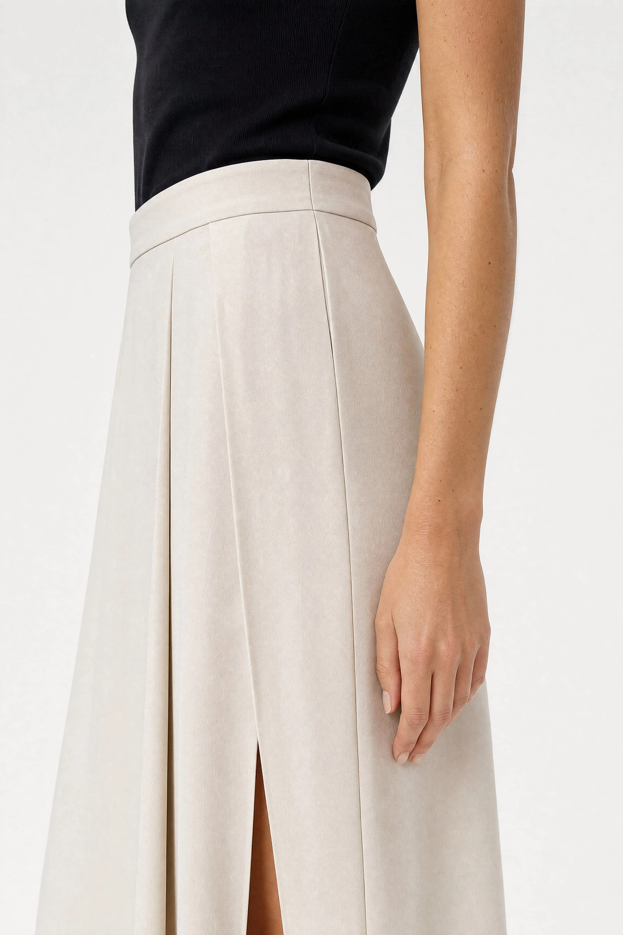 Detail of the side slit of the long ivory viscose skirt