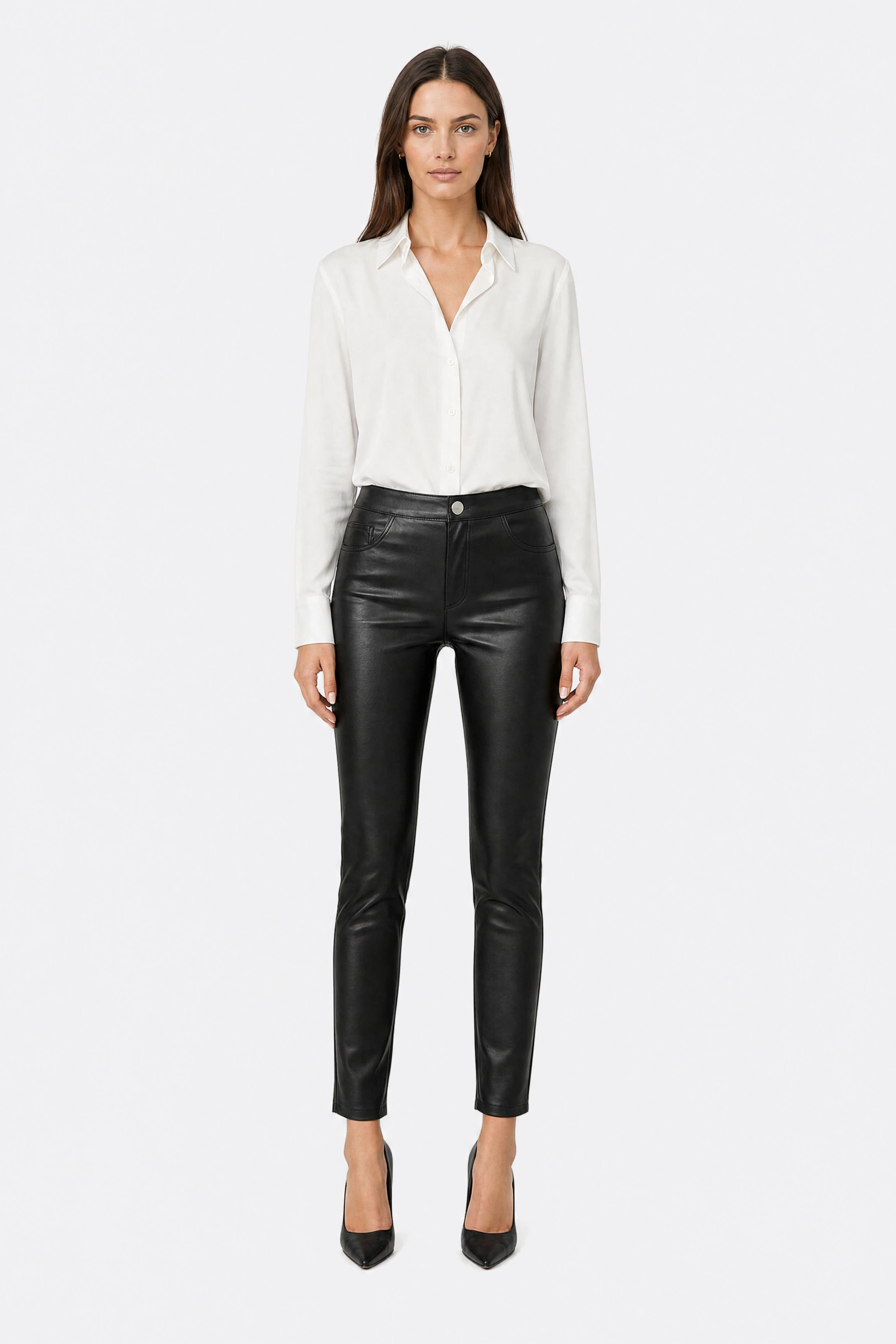 Black faux leather trousers, front view in the studio