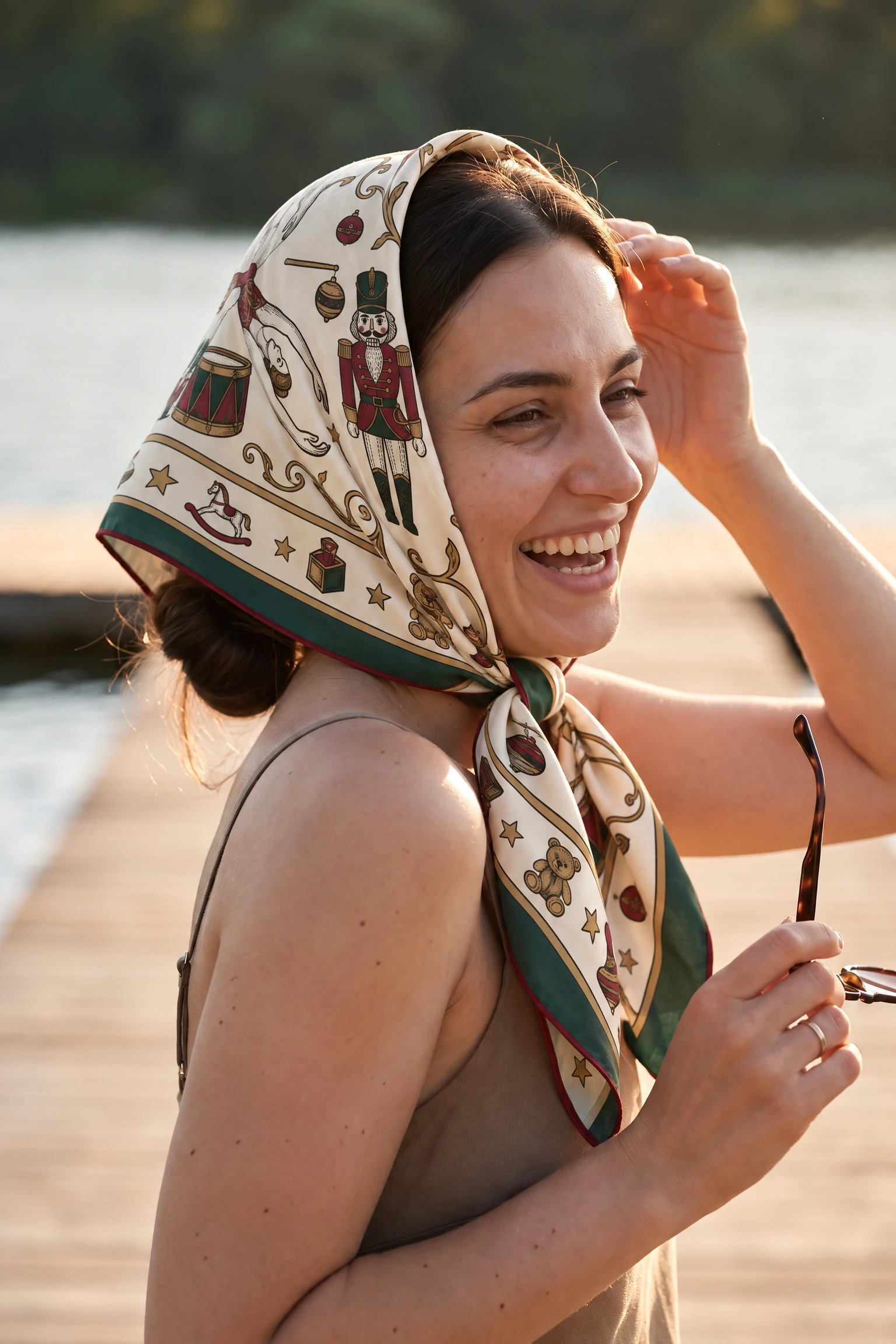 Woman wearing the Casse-noisette silk scarf as a bandana in her hair on a Paris street