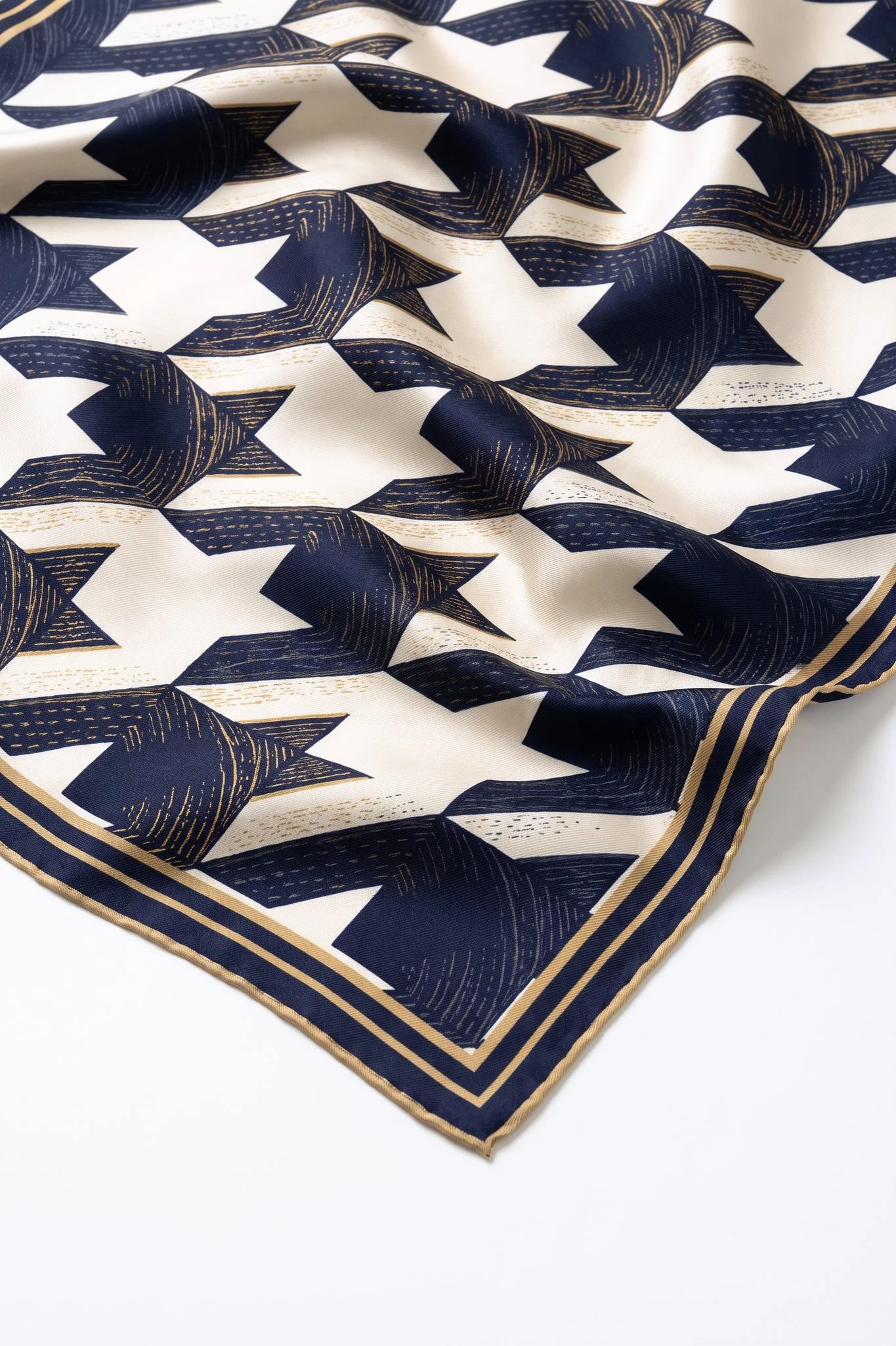Close-up on the folds of the Parisian houndstooth silk square, silk twill and hand-rolled hem