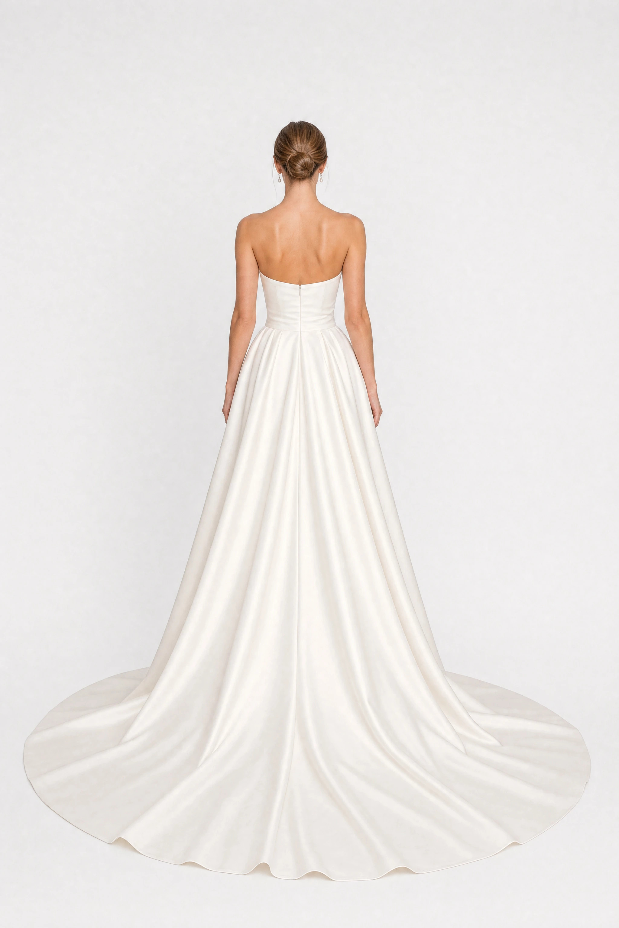 Long white satin strapless wedding dress with a train, back view