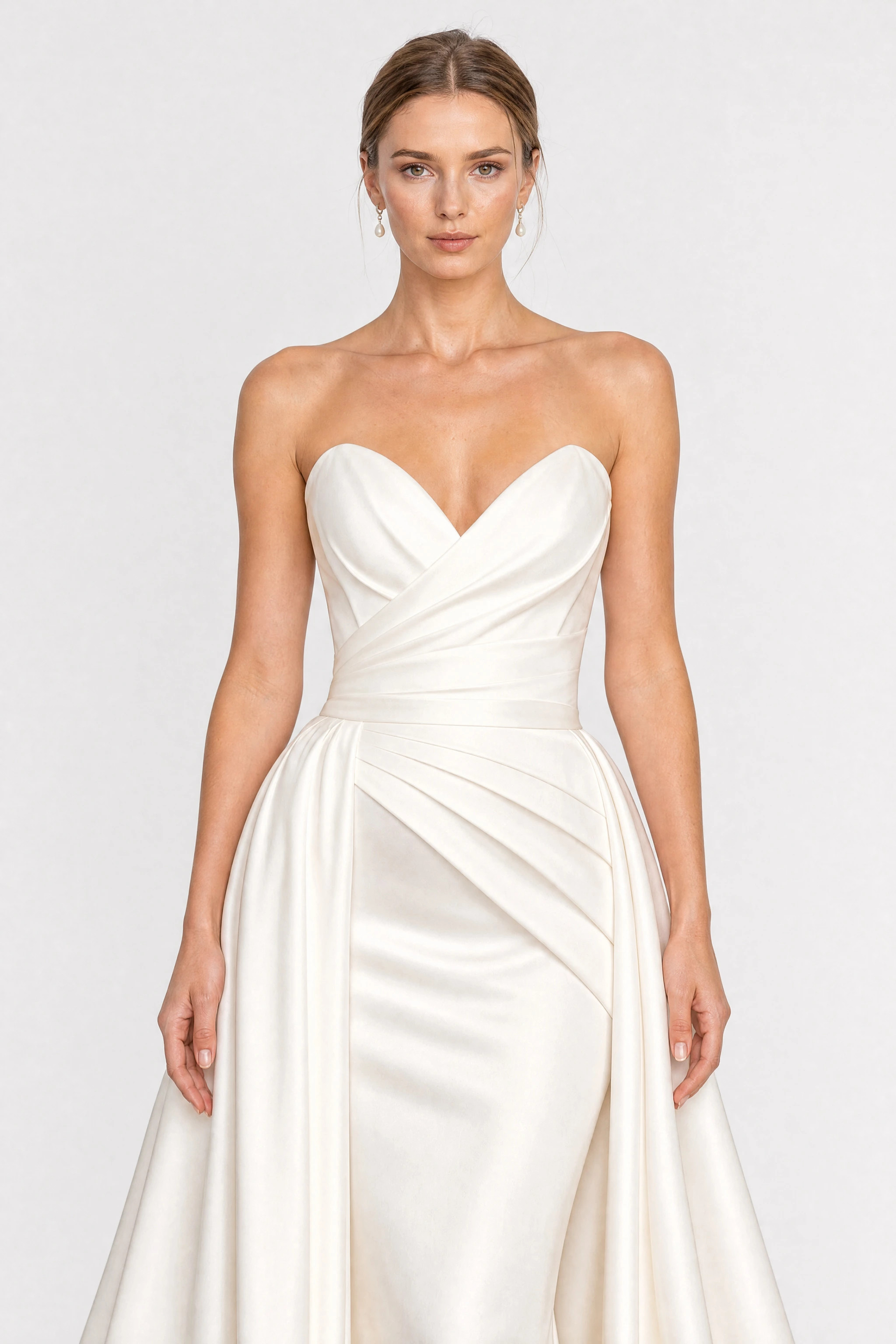 Long white satin strapless wedding dress with a train, detail of the draped sweetheart bodice